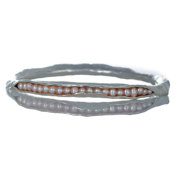 Silver pod bangle with pink pearls